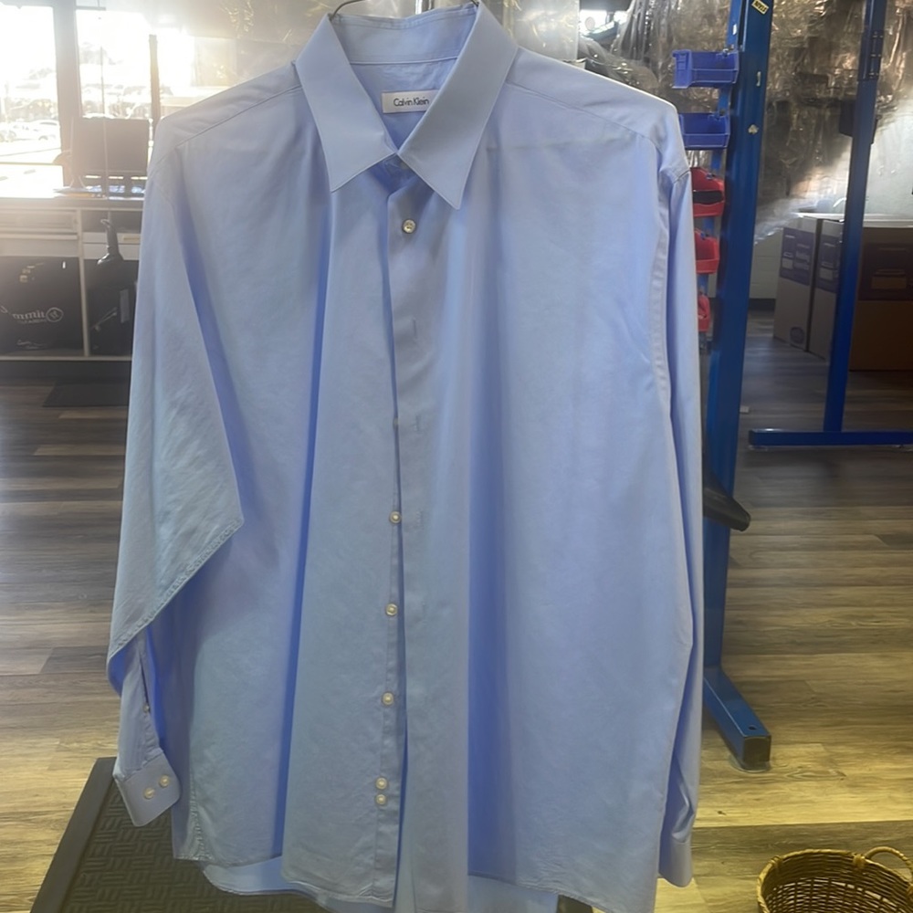 Blue Calvin Klein button up shirt